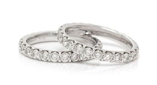 A Pair of 18 Karat White Gold and Diamond Eternity Bands, Memoire, 3.70 dwts.