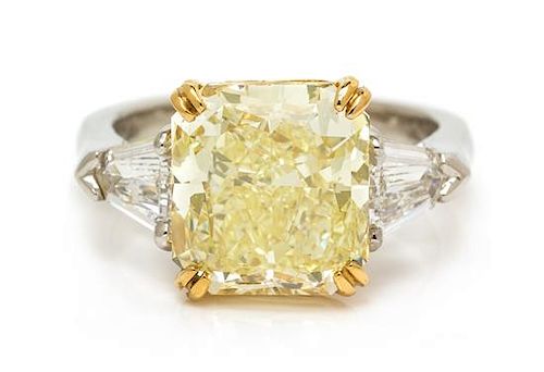 A Platinum, 22 Karat Yellow Gold, Fancy Yellow Diamond and Diamond Ring, 8.00 dwts.