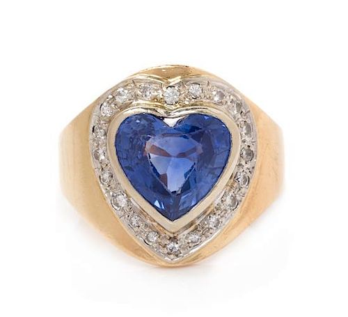 * A 14 Karat Yellow Gold, Sapphire and Diamond Ring, 6.90 dwts.