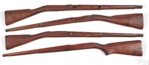 Four model 1903 stocks