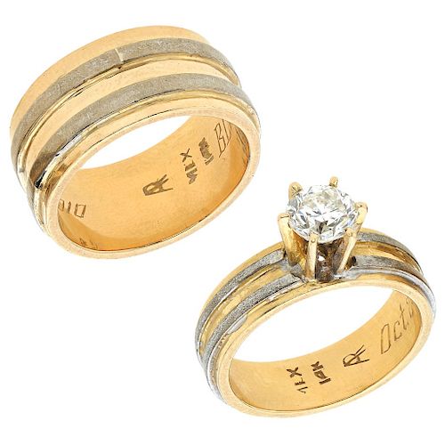 A 14K yellow and white gold wedding and solitaire ring set.