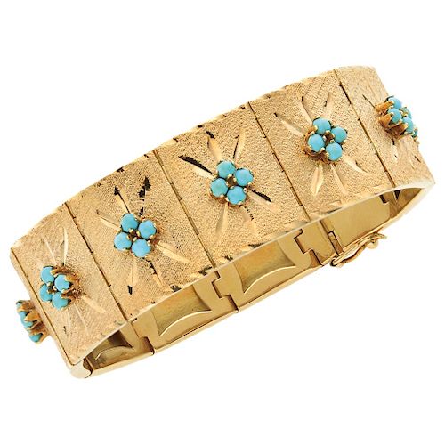 A turquoise 18K yellow gold bracelet.