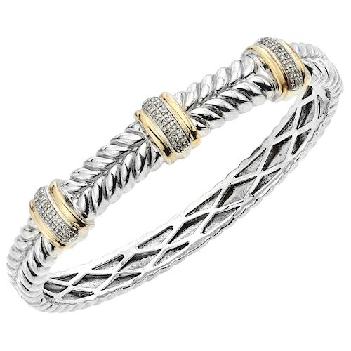 A diamond sterling silver and 14K yellow gold bangle.