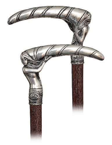 2. Silver Art Nouveau Cane -Ca. 1900 -High grade, L-shaped figural silver handle lively modeled, heavily cast and finely hand chased to depict the bus