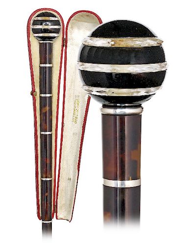 5. Evening Hard Stone and Tortoiseshell Dress Cane -Ca. 1900 -Black onyx and faceted rock crystal ball handle presented on a longer stem consisting of