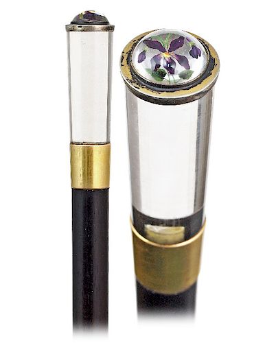 25. Essex Crystal Cane -Ca. 1880 -Straight and tapering rock crystal knob cut of a pure and limpid stone and fitted with a reversed carved and colored