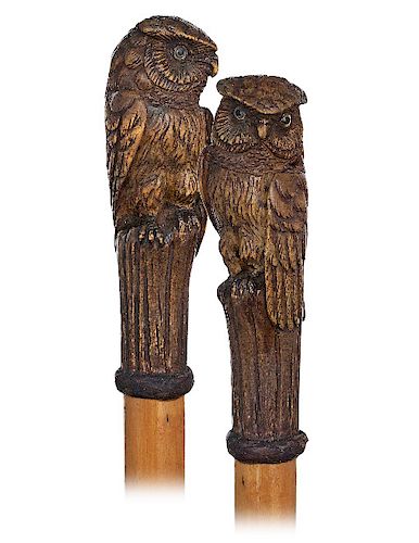 26. Owl Cane -Ca. 1900 -Very large pearwood handle carved to depict an owl perched atop of a wood stem, rarely encountered boxwood shaft with a braide