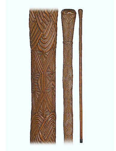 63. Polynesian Maori Cane -Ca. 1890 -Fashioned of a hardwood branch freed from its bark with a natural bough as knob and entirely carved with various 