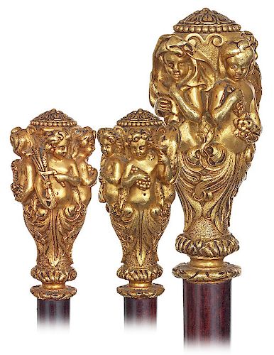 86. Early Four Seasons Cane -Ca. 1850 -Fire gilt bronze handle fashioned in a basic reversed pear shape and delicately modeled with four putti with re