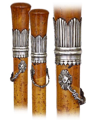 93. Coquilla Nut and Silver German Court Cane -Ca. 1800 -Sizeable and elongated plain turned coquilla nut knob set in a vertically reeded pattern disc