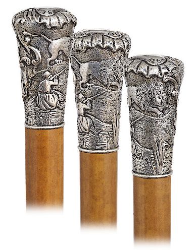 105. Silver Lion Hunting Cane -Ca. 1850 -Large silver knob hand chased and engraved with a panel showing a man hunting a lion on one side and lavish B