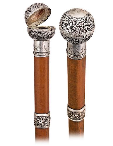 107. Silver Dual Purpose Ball Container Cane -Ca. 1880 -Silver ball knob with an integral cylindrical collar profusely hand chased with leafage and fi