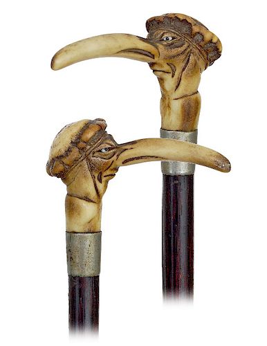 140. Stag horn Satirical Cane  -Ca. 1880 -A carved portrait stag horn handle of a man with a long nose out of proportions liven up with two inset glas
