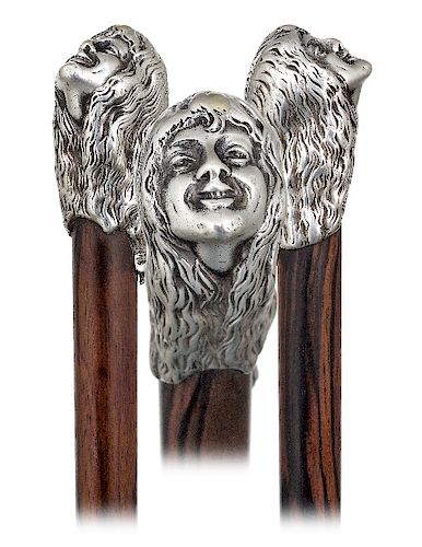 65. Silver Figural Art Nouveau Cane -Ca. 1900  -Silver cap well modeled, cast and finely hand chased to depict the head of a young girl with a smiling