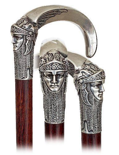 69. Silver Figural Day Cane -Ca. 1890 -Large silver crook handle modeled in very fine detail with the head of a knight with armor helmet above a chain