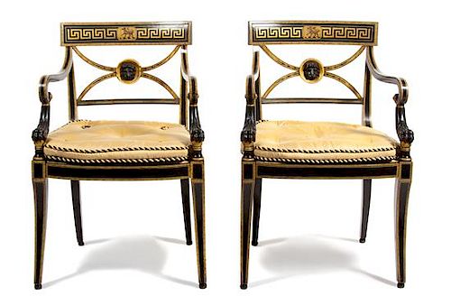 A Pair of Regency Style Painted and Gilt Armchairs Height 33 inches.