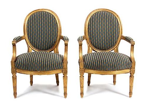 A Pair of Louis XVI Style Giltwood Fauteuils Height 36 inches.