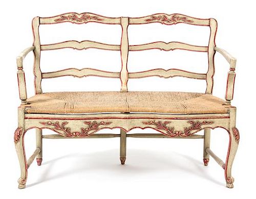 A Louis XV Style Carved and Painted Two-Chair Back Settee Height 37 1/4 x width 51 inches.