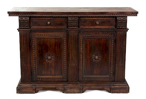A Jacobean Style Carved and Stained Pine Side Cabinet Height 40 1/4 x width 60 1/4 x depth 19 3/4 inches.