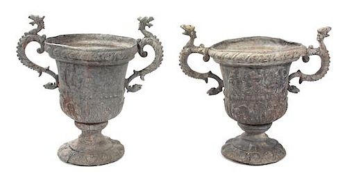 A Pair of English Cast Lead Garden Urns Height 22 1/2 x width 24 1/2 x depth 14 inches.