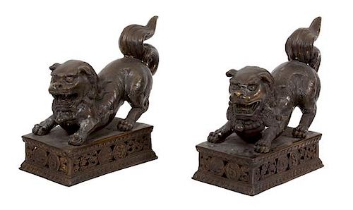 A Pair of Chinese Bronze Foo Dogs Height 14 inches.