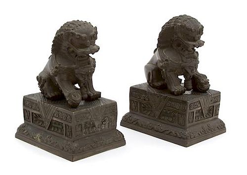 A Pair of Chinese Bronze Foo Dogs Height 7 1/8 inches.