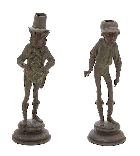 A Pair of French Patinated Metal Figural Candlesticks by Emile Guillemin Height of taller 13 inches.