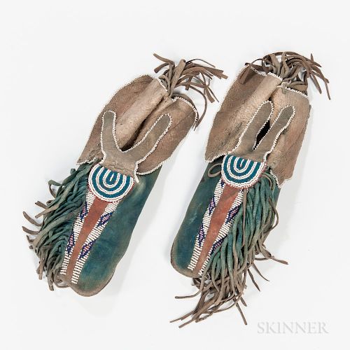 Kiowa Beaded Hide Man's Moccasins, third quarter 19th century, partially beaded with multicolored geometric designs in two rows and on