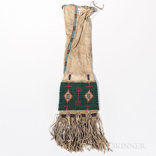 Lakota Beaded Hide Pipe Bag, fourth quarter 19th century, the soft hide bag beaded with geometric designs on two different colored back