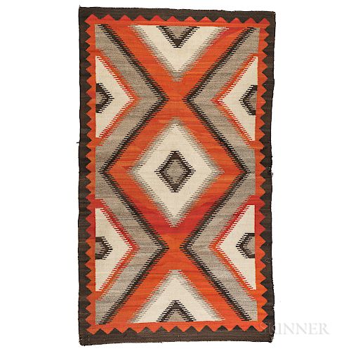 Navajo Rug, c. early 20th century, with a multicolored concentric diamond design on a variegated background, bold zigzag border, natura