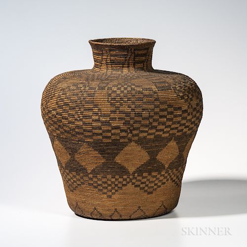 Large Apache Polychrome Basketry Olla, c. late 19th century, with high round shoulder and flared rim, woven in a complex diamond lattic
