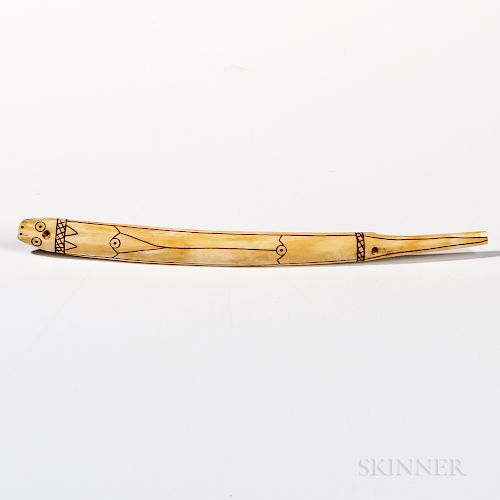 Eskimo Toggle, Alaska, 19th century, carved from a walrus tusk, lg. 9 3/4 in.