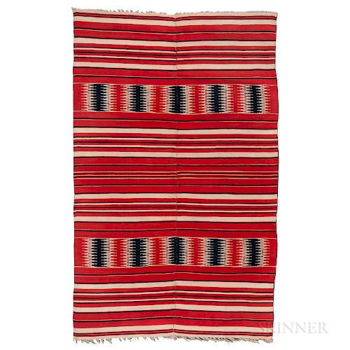 Oaxaca Blanket, Mexico, c. 1870, woven in two panels and stitched together, with red, indigo, and natural wool colors, with short fring