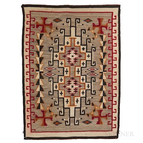 Navajo Regional Rug, c. 1930s, woven with natural and synthetic spun wool, with elaborate geometric designs on a variegated gray backgr