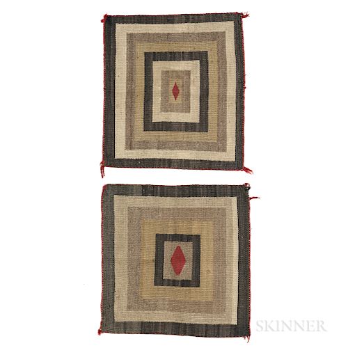 Two Navajo Saddle Blankets, early 20th century, both with natural and commercially dyed homespun wool, multi-squared pattern with centr