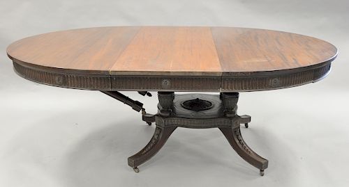 Round Victorian mahogany single pedestal table with six 22 inch leaves. ht. 29 1/2 in., dia. 60 in.