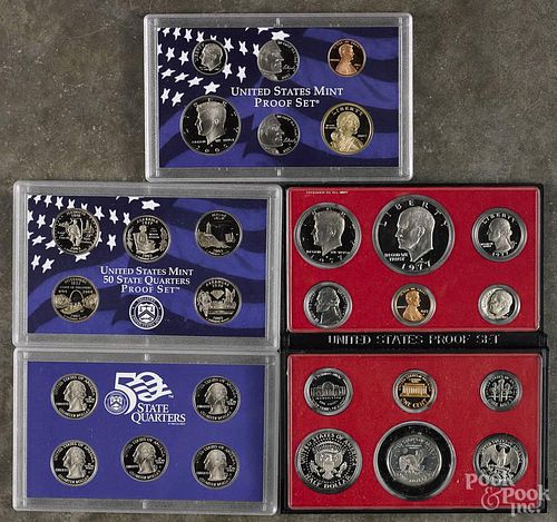 Four United States proof sets, to include examples from 1977, 1979, 2003 (quarters), and 2005.