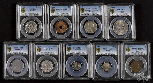 Nine assorted foreign coins, to include two Ecuadorian Sucre, 1986, PCGS AU-58 and MS-62, a Vatican