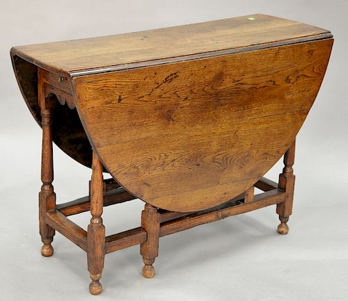 William and Mary oak gateleg oval one drawer table with drop leaves, length 54 inches.