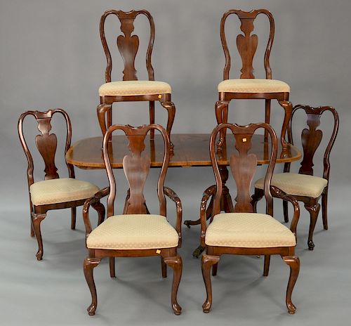 Seven piece lot to include a mahogany double pedestal dining table with banded inlaid top plus four 13 1/2 inch leaves
