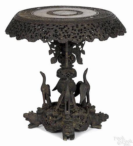 Elaborate Anglo-Indian carved padouk center table, late 19th c., 29 1/2'' h., 29 1/2'' w.
