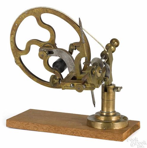 Watchmaker's brass and steel rounding up tool, 19th c., with a wheel cutting lathe and wooden base