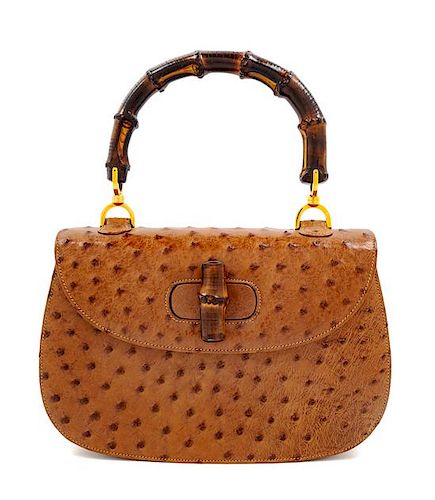 A Gucci Brown Ostrich Bamboo Top Handle Handbag, 7" H x 10.5" W x 2.5" D; Handle drop: 4.5".