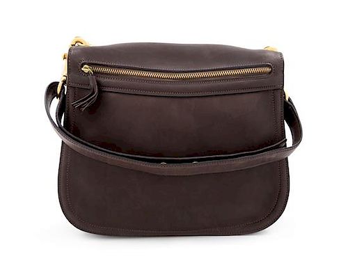 A Gucci Brown Leather Vintage Reversible Saddle Shoulder Bag, 9.75" H x 10.75" W x 2" D; Strap drop: 8.5"- 9".