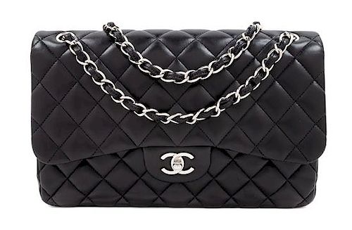 A Chanel Black Quilted Lambskin Jumbo Double Flap Bag, 8.25" H x 12" W x 3.5" D; Strap drop: 13.5"- 23.75".