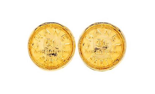 A Pair of Chanel Goldtone Coin Earclips, 1.25" diameter.