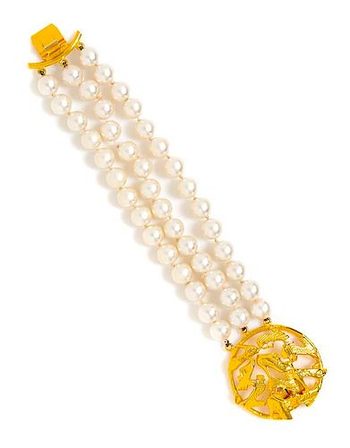 A Salvatore Ferragamo Three Strand Faux Pearl Bracelet, Length: 8"; Logo clasp: 1.75" diameter.