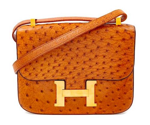An Hermès Cognac Ostrich Constance Bag, 7" H x 9" W x 2" D; Strap drop: 14" or 8.5".