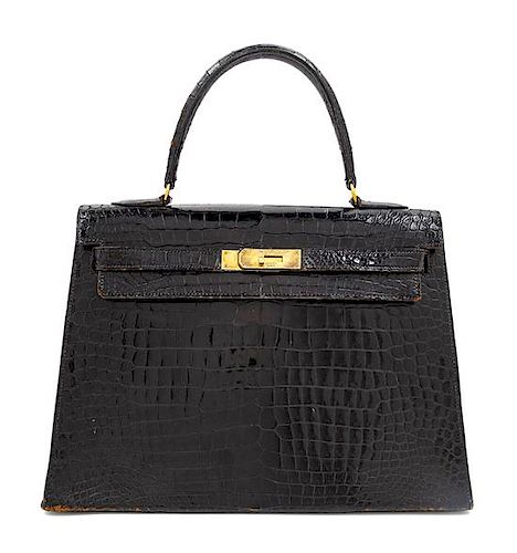 An Hermès Vintage Black Crocodile Kelly Bag, 9" L x 13" W x 4.5" D; Handle drop: 4.5".