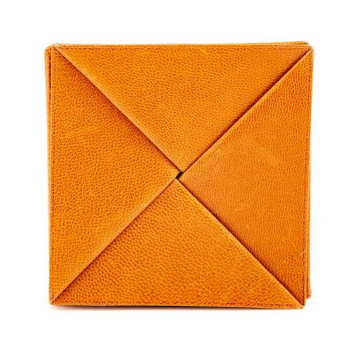 An Hermès Orange Leather Zulu Coin Purse, 3.25" x 3.25".